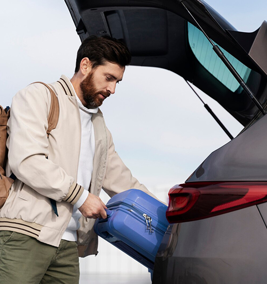 A right close up of a yellow Mercedes AMG sports car headlight on a city street